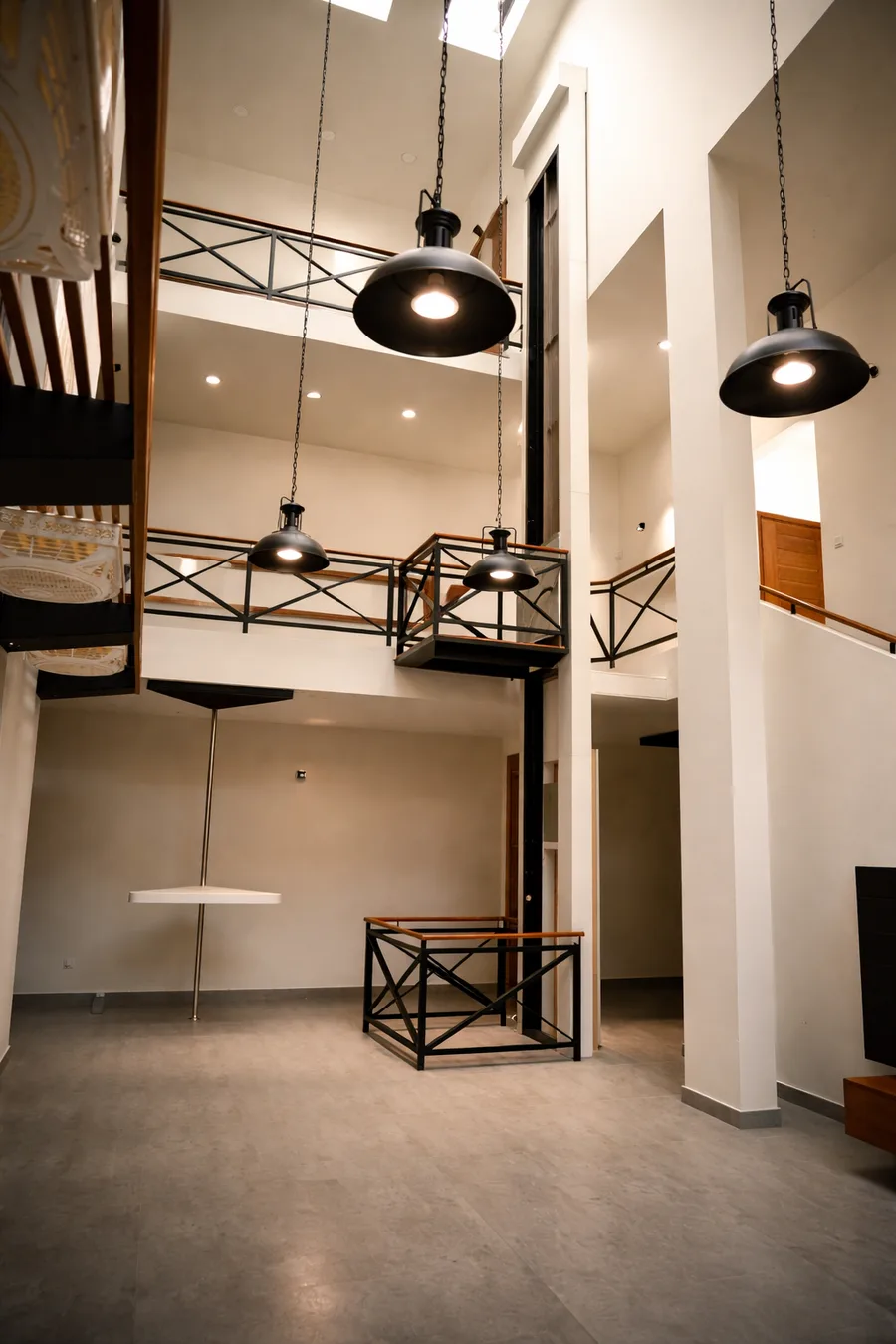 AirRail railing-style open-view home lift in a bright loft interior