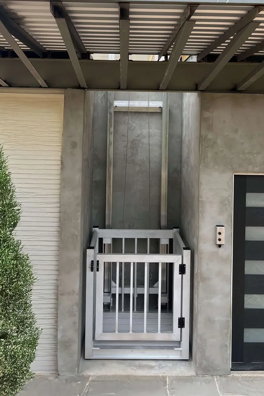 AirRail railing-style open-view home lift in a bright loft interior