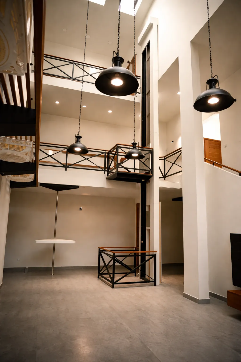 AirRail railing-style open-view home lift in a bright loft interior