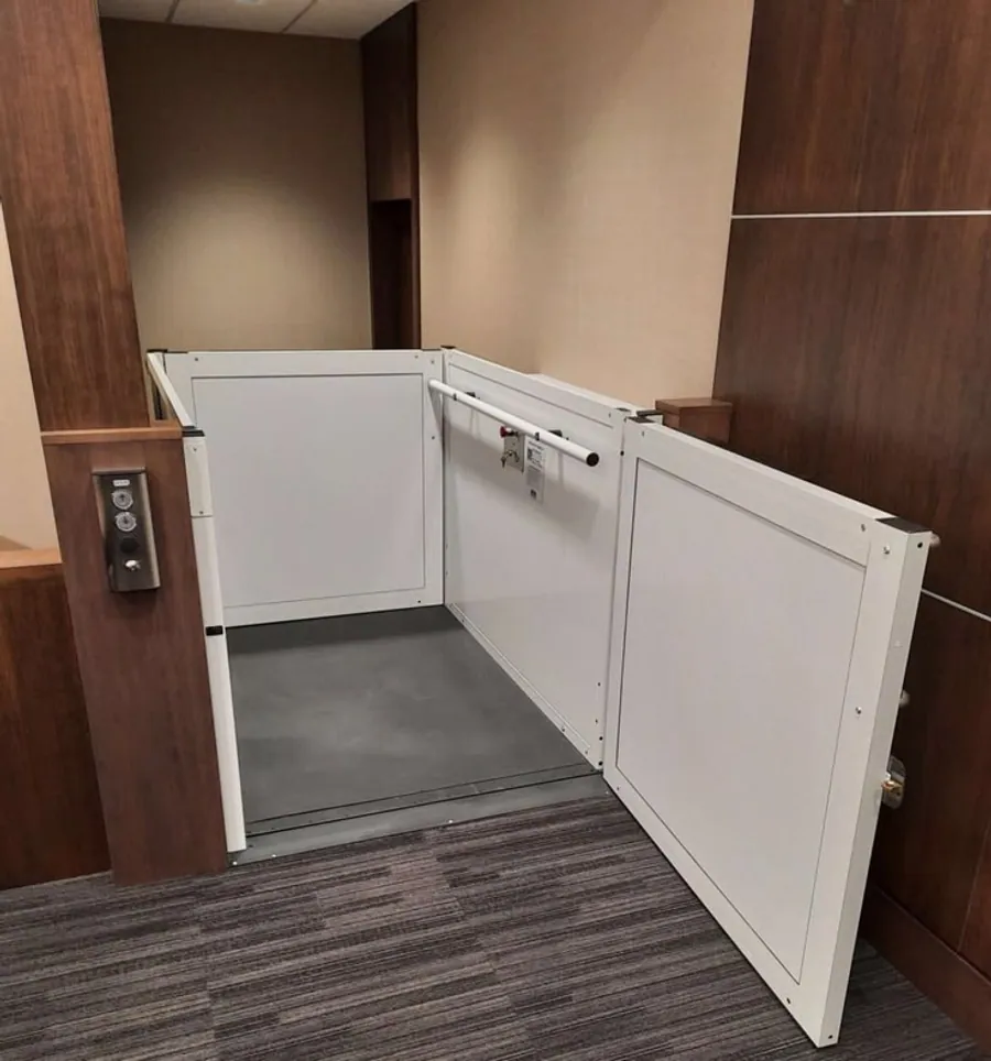 Railing-style residential elevator with open-view design