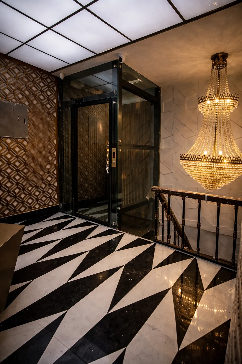 Elegant hallway with a glass home elevator installed by Vertico Elevators