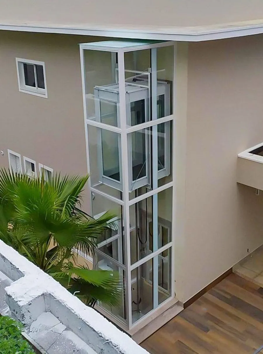 EnclosureX steel and glass structure elevator in an elegant hallway