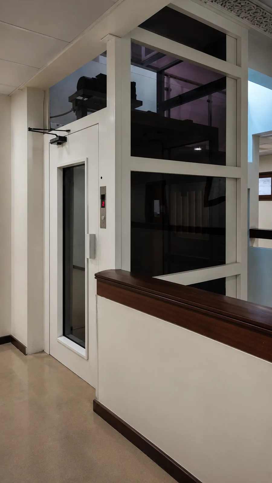 EnclosureX elevator structure with slim steel frame and glazing