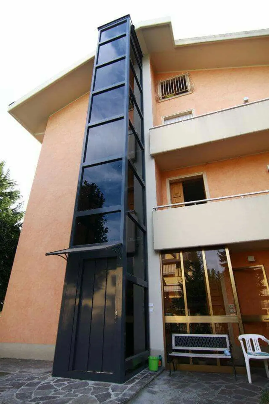 EnclosureX elevator structure with slim steel frame and glazing