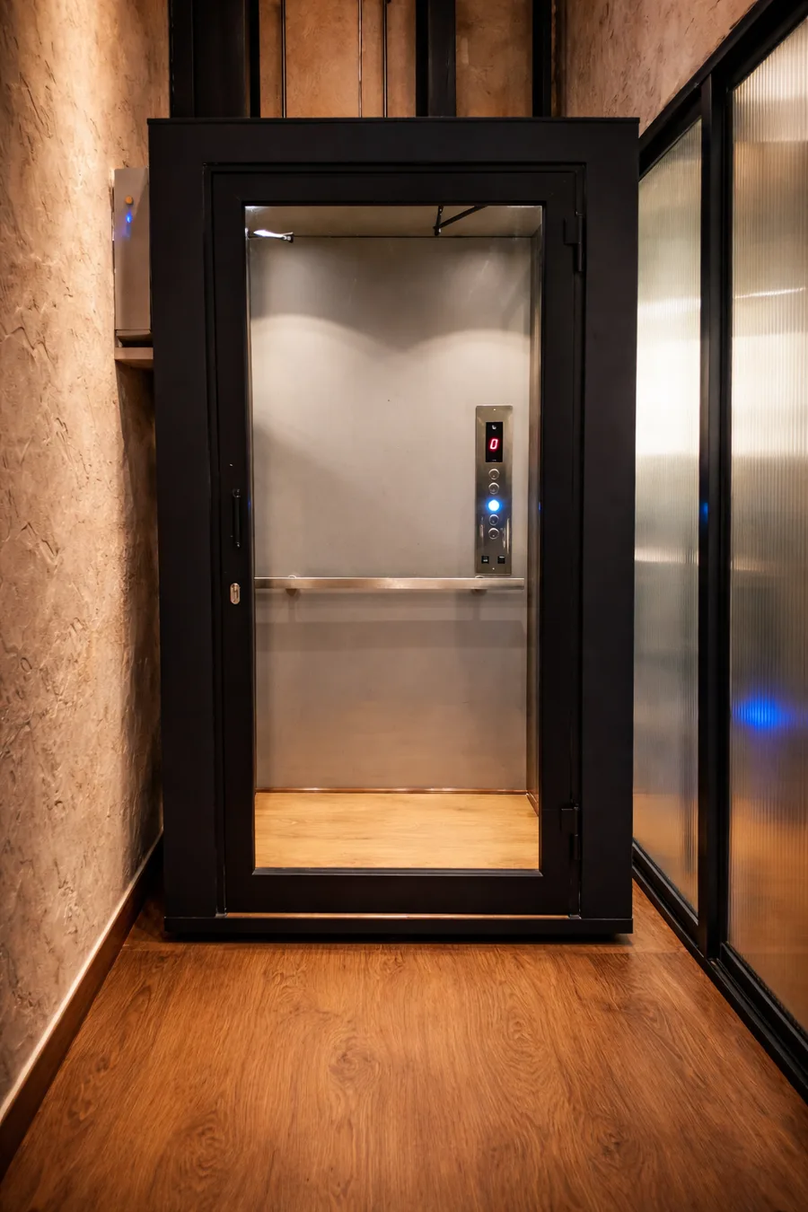 Sleek indoor glass elevator by Vertico Elevators