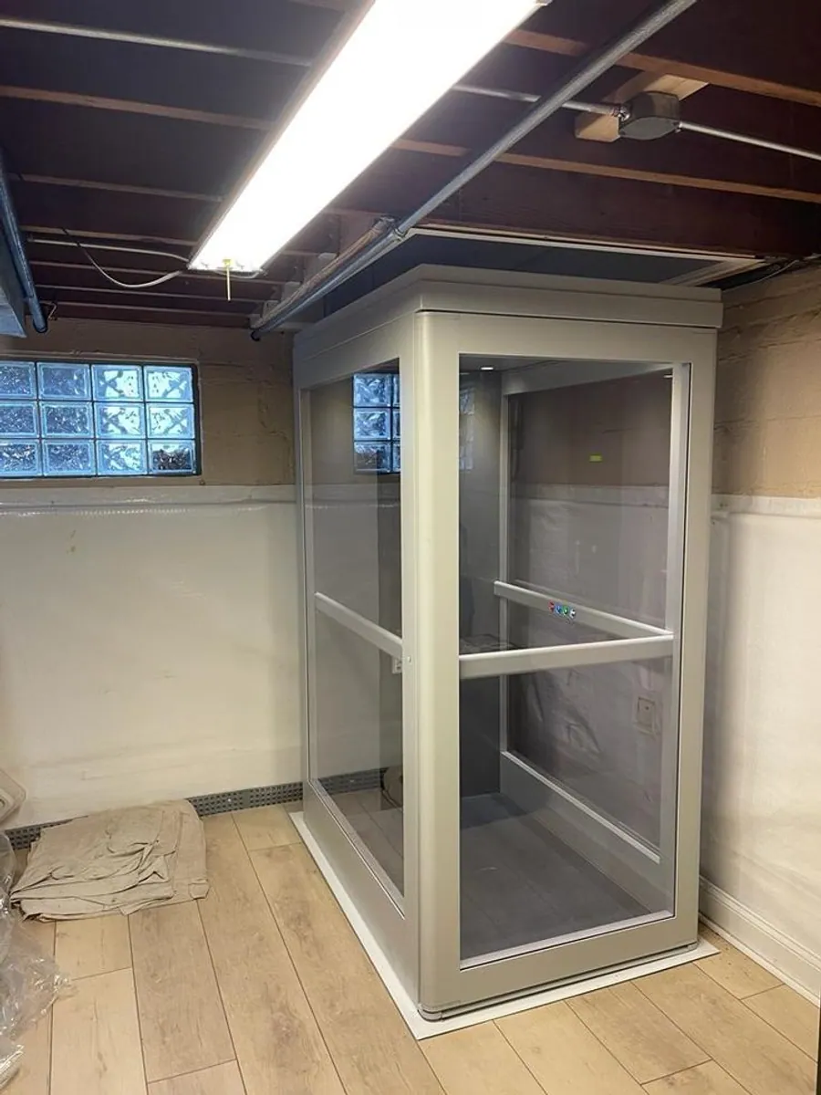 Sleek indoor glass elevator by Vertico Elevators