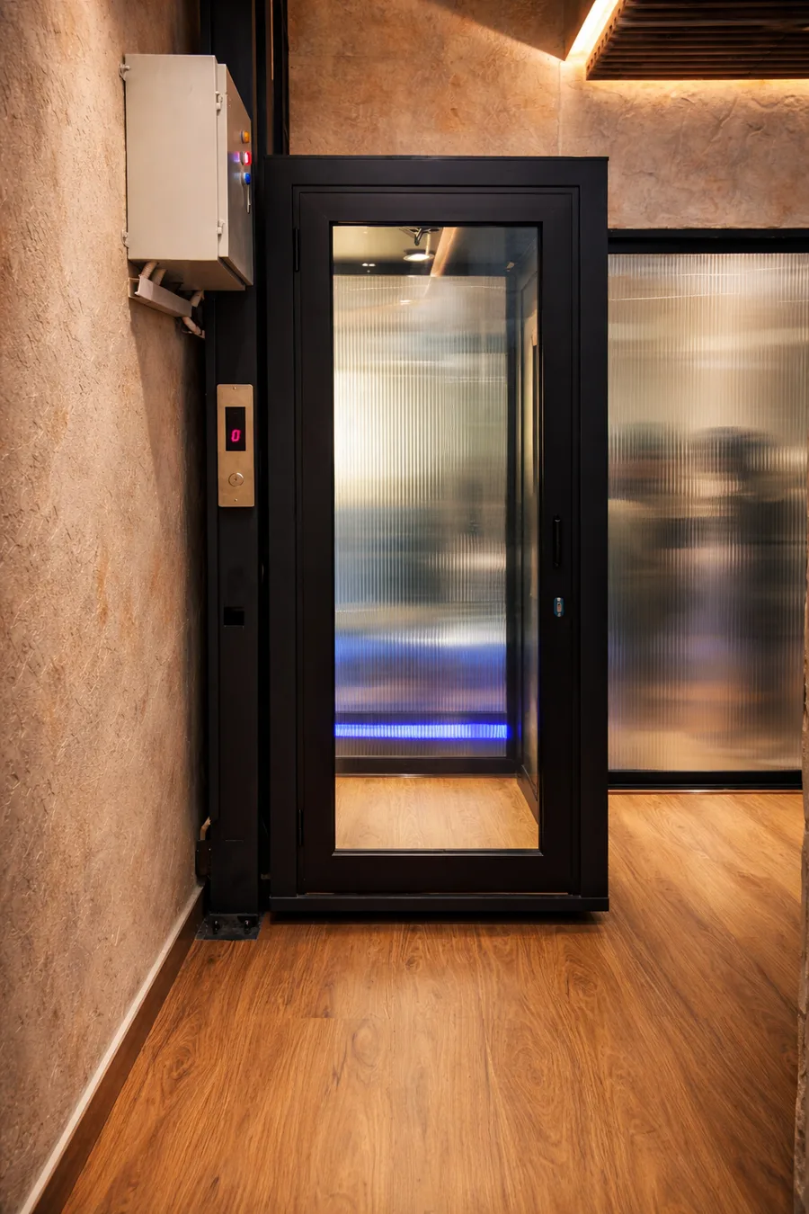 Black-framed glass elevator design by Vertico Elevators