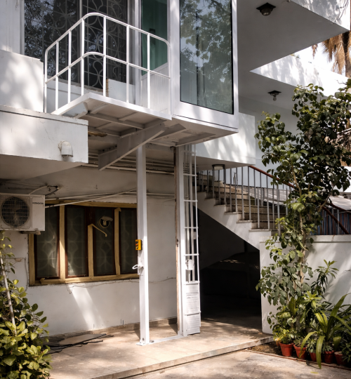 Modern white glass elevator exterior