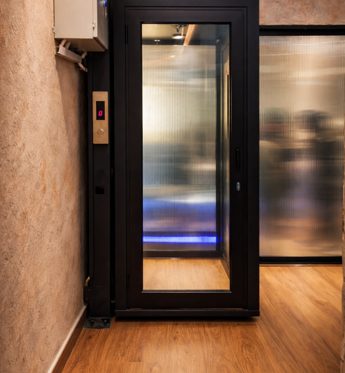 sleek black framed glass elevator design